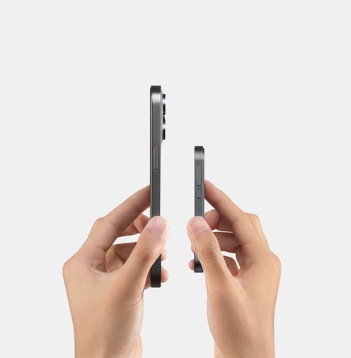 Tea Pro beside a phone, both held upright