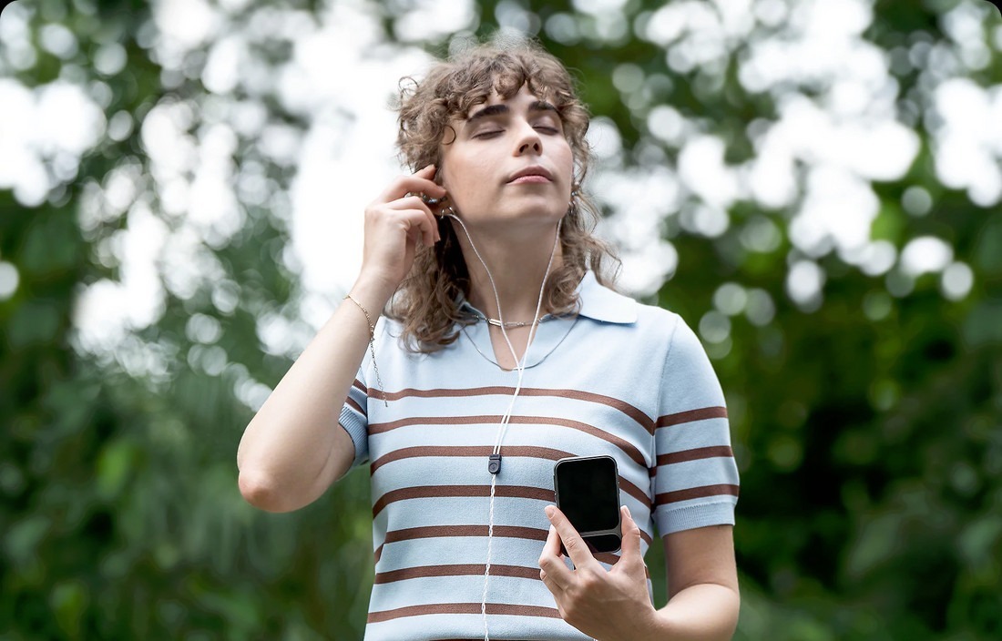Earphones beside Tea Pro