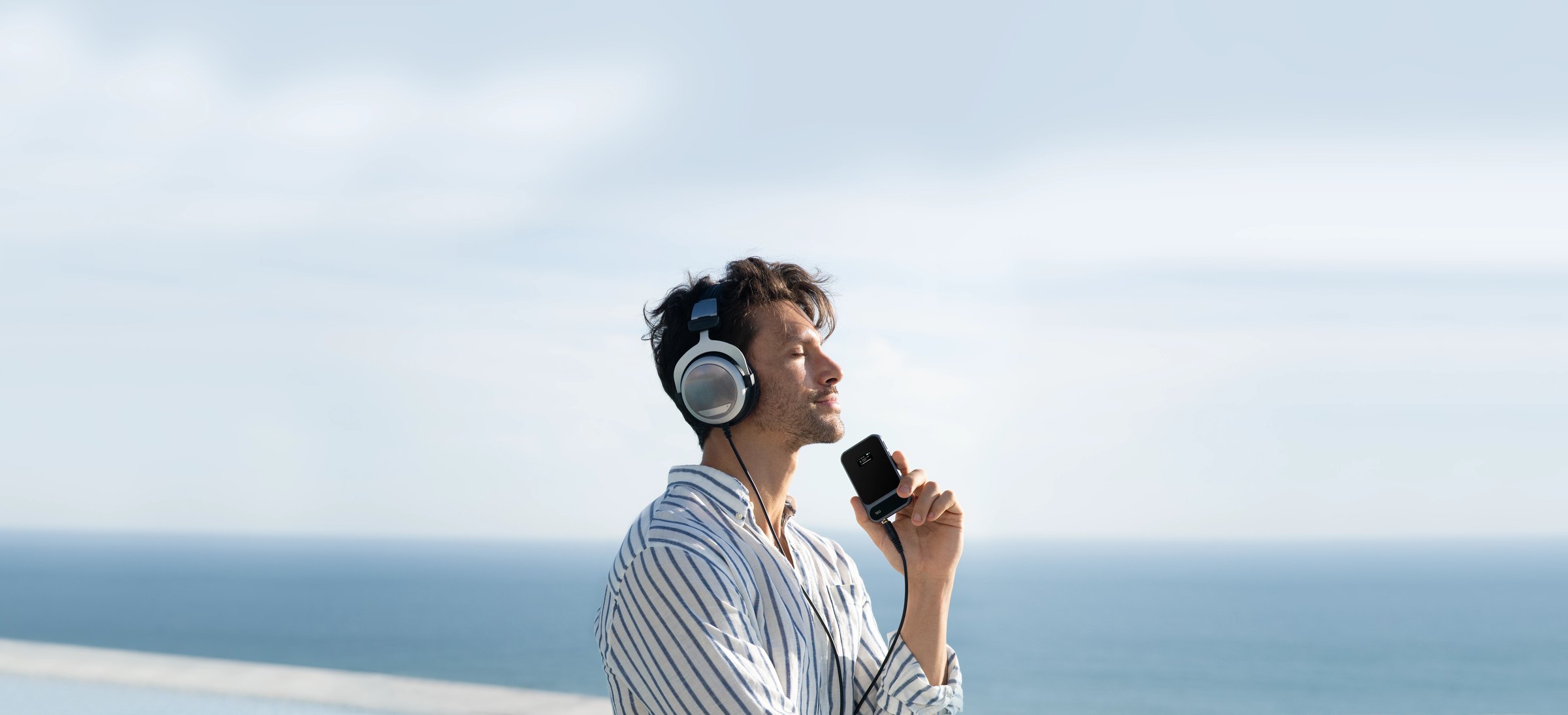 Listening to Tea Pro by the sea